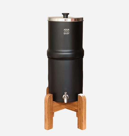 Black water dispenser with wooden stand on a white background