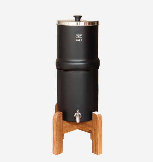 Black water dispenser with wooden stand on a white background